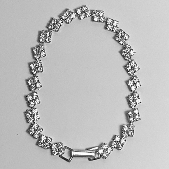 Rhinestone and sterling silver tennis bracelet. - Picture 1 of 2